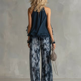 Marie | Ensemble élégant avec haut dos nu bleu marine et pantalon large imprimé