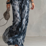 Chloé | Ensemble élégant avec haut dos nu bleu marine et pantalon large imprimé